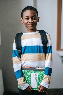 Boy holding books 